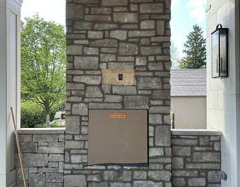Outdoor stone fireplace built for entertaining